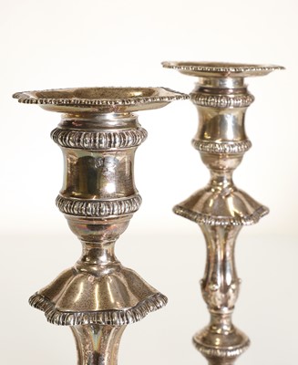 Lot 23 - A pair of George III silver candlesticks