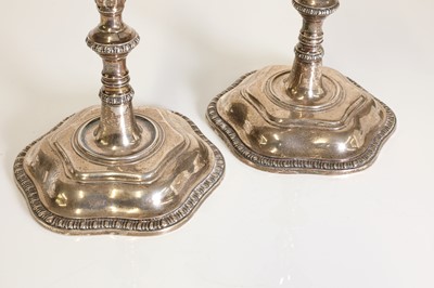 Lot 23 - A pair of George III silver candlesticks