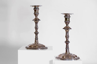 Lot 23 - A pair of George III silver candlesticks