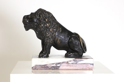 Lot 58 - A bronze model of a crouching lion