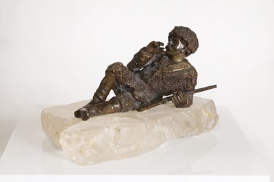 Lot 70 - A bronze figure of a reclining hunter