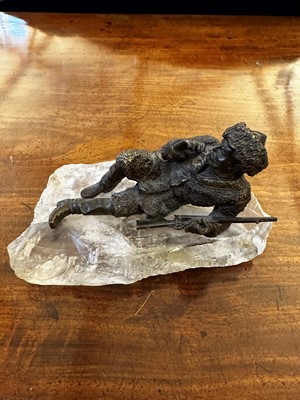 Lot 70 - A bronze figure of a reclining hunter