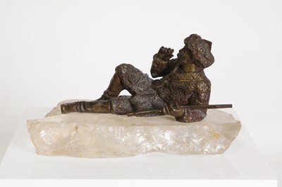 Lot 70 - A bronze figure of a reclining hunter
