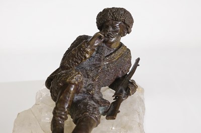 Lot 70 - A bronze figure of a reclining hunter