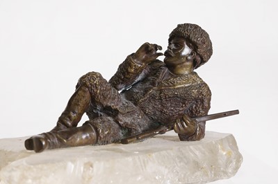 Lot 70 - A bronze figure of a reclining hunter