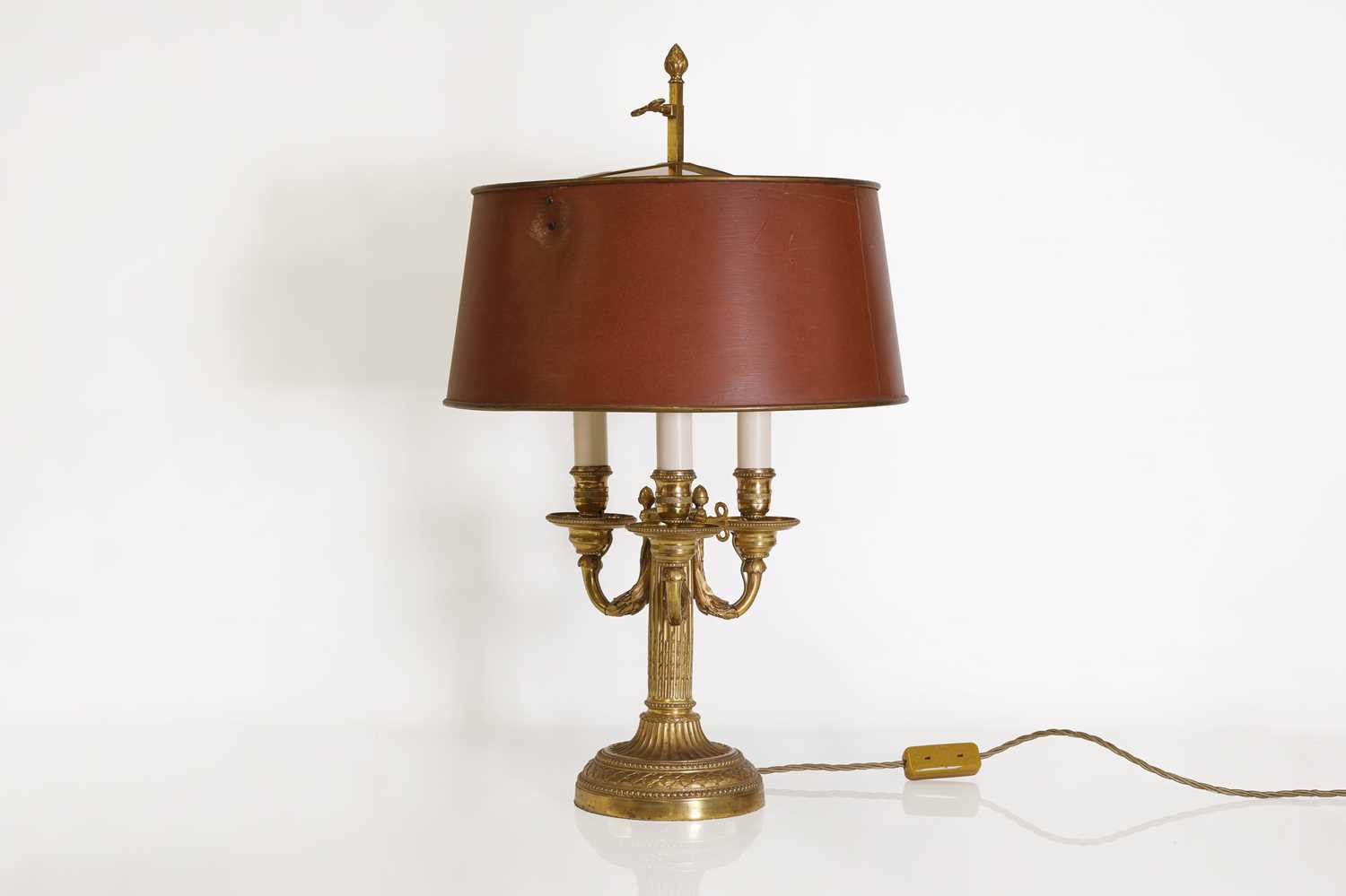 Lot 62 - A Directoire-style ormolu three-light bouillotte lamp