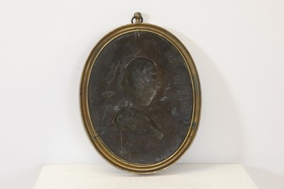 Lot 109 - A bronze oval portrait plaque