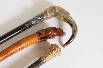 Lot 124 - A horn, silver-mounted and stained hardwood walking stick