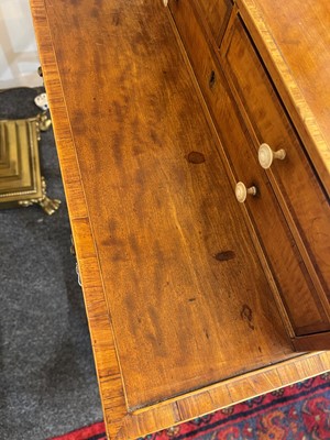 Lot 130 - A matched pair of satinwood cheveret tables