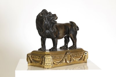 Lot 163 - A patinated bronze figure of a lion