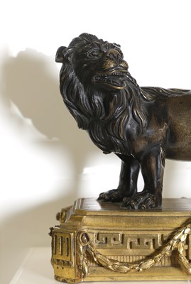 Lot 163 - A patinated bronze figure of a lion