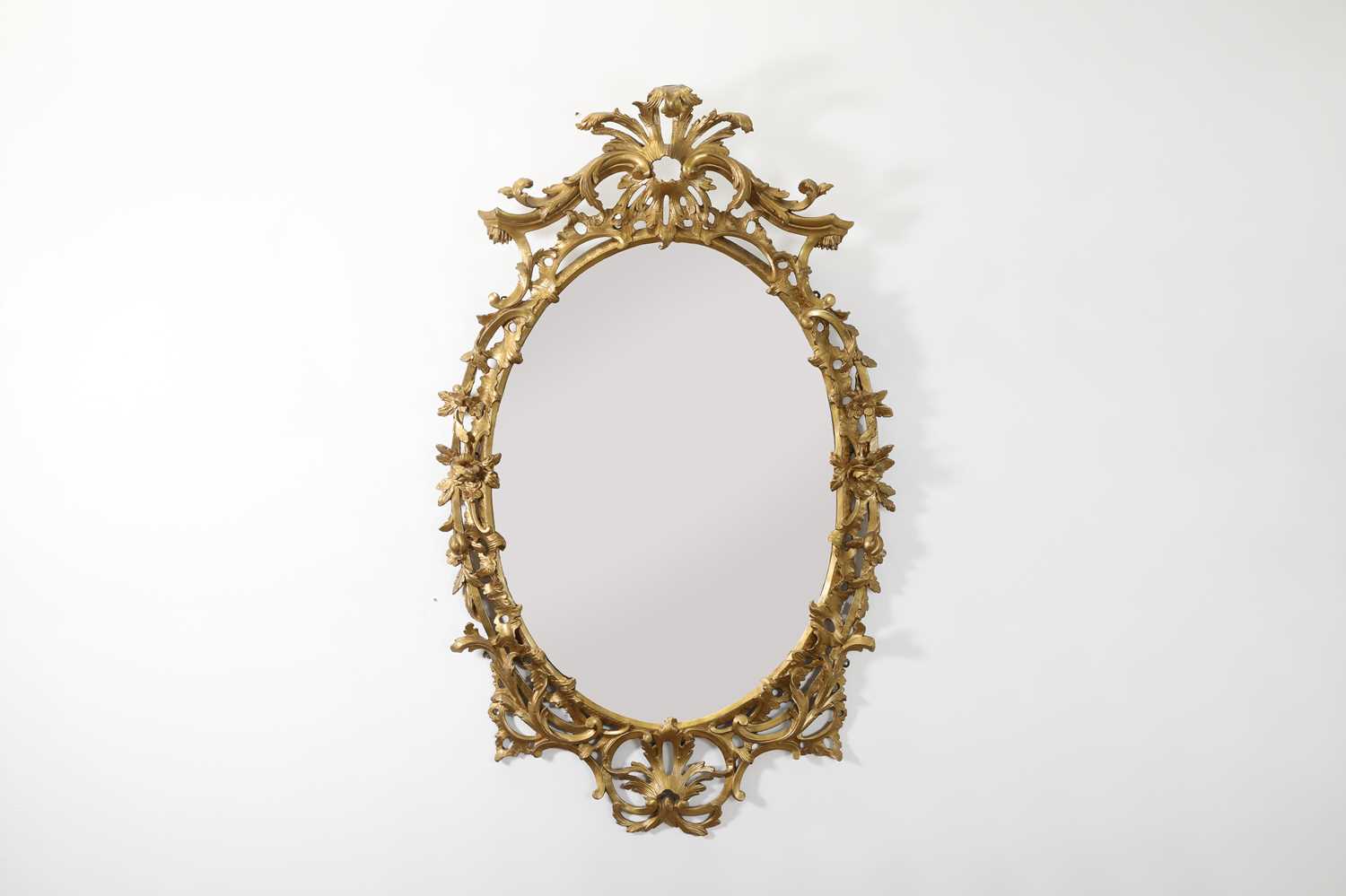 Lot 166 - A George III-style giltwood oval mirror