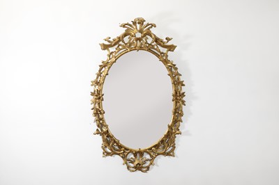 Lot 166 - A George III-style giltwood oval mirror