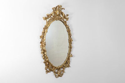 Lot 166 - A George III-style giltwood oval mirror