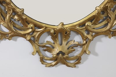 Lot 166 - A George III-style giltwood oval mirror