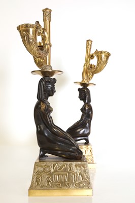 Lot 153 - A pair of Empire-style gilt and patinated bronze candelabra