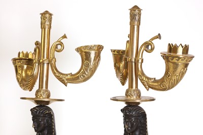 Lot 153 - A pair of Empire-style gilt and patinated bronze candelabra