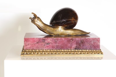 Lot 193 - A tiger's eye and ormolu snail