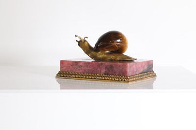 Lot 193 - A tiger's eye and ormolu snail