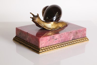 Lot 193 - A tiger's eye and ormolu snail