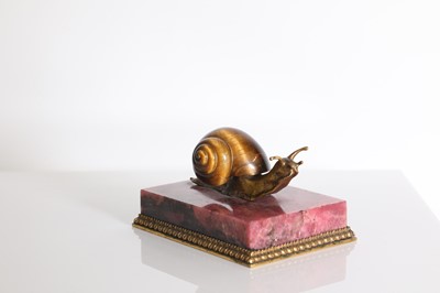 Lot 193 - A tiger's eye and ormolu snail