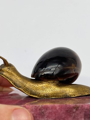 Lot 193 - A tiger's eye and ormolu snail