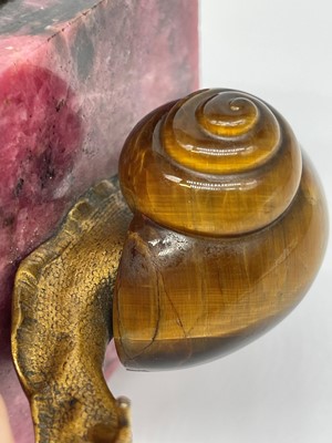 Lot 193 - A tiger's eye and ormolu snail