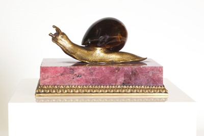 Lot 193 - A tiger's eye and ormolu snail