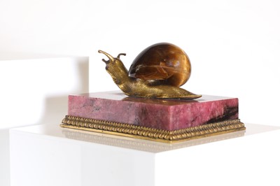 Lot 193 - A tiger's eye and ormolu snail