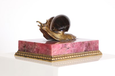 Lot 193 - A tiger's eye and ormolu snail