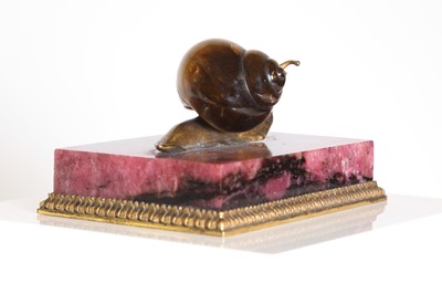 Lot 193 - A tiger's eye and ormolu snail