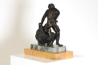 Lot 194 - A patinated bronze figure group after the antique