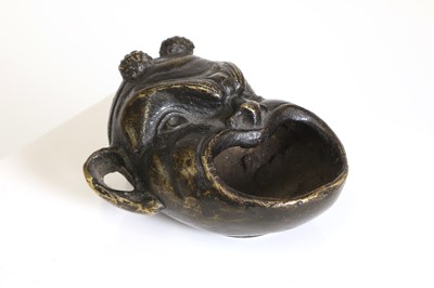 Lot 181 - A patinated bronze oil lamp