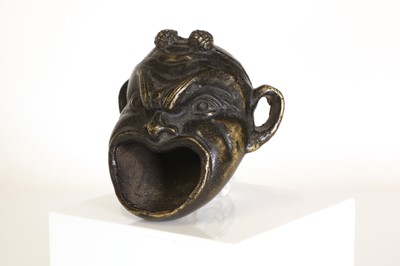 Lot 181 - A patinated bronze oil lamp