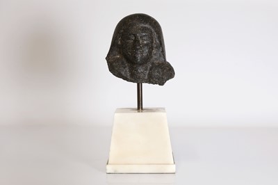 Lot 208 - An Egyptian-style carved granite head of a man