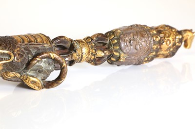 Lot 218 - A Tibetan gilt-bronze phurba