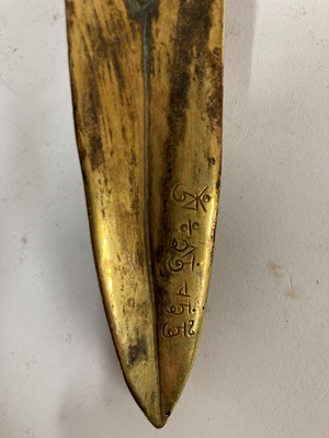 Lot 218 - A Tibetan gilt-bronze phurba