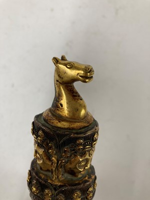 Lot 218 - A Tibetan gilt-bronze phurba