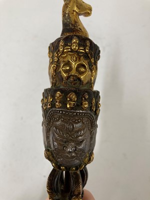 Lot 218 - A Tibetan gilt-bronze phurba
