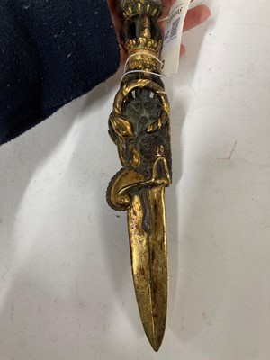 Lot 218 - A Tibetan gilt-bronze phurba