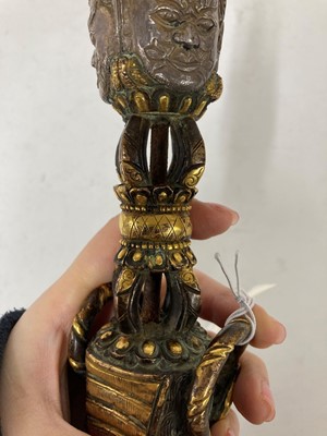 Lot 218 - A Tibetan gilt-bronze phurba
