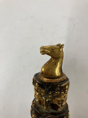 Lot 218 - A Tibetan gilt-bronze phurba