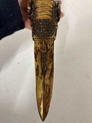 Lot 218 - A Tibetan gilt-bronze phurba