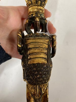 Lot 218 - A Tibetan gilt-bronze phurba