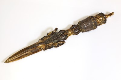 Lot 218 - A Tibetan gilt-bronze phurba