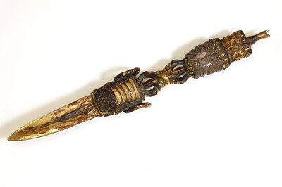 Lot 218 - A Tibetan gilt-bronze phurba