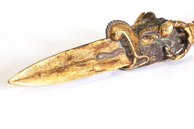Lot 218 - A Tibetan gilt-bronze phurba