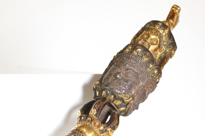 Lot 218 - A Tibetan gilt-bronze phurba