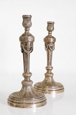 Lot 43 - A pair of German cast silver candlesticks