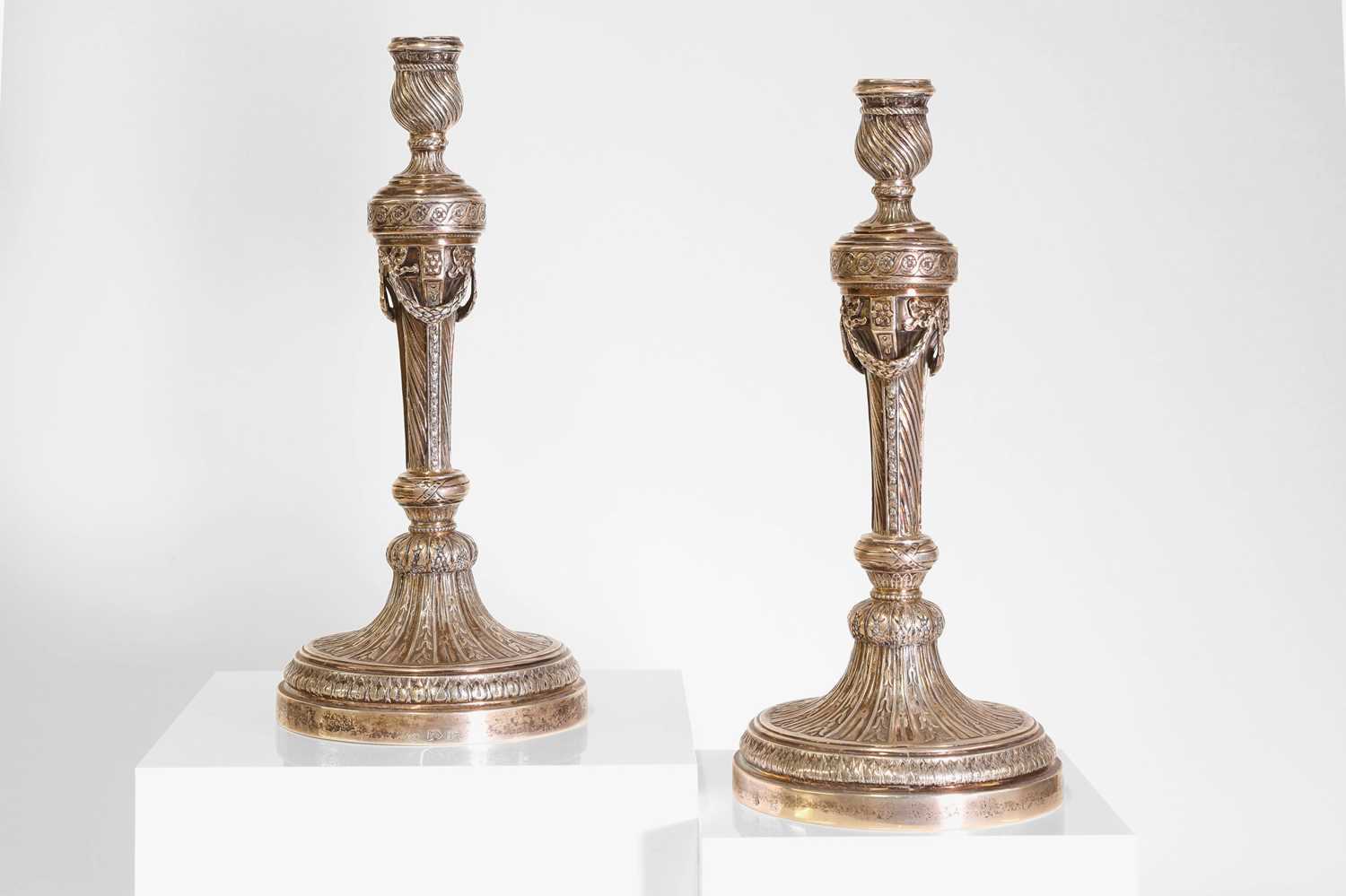 Lot 43 - A pair of German cast silver candlesticks